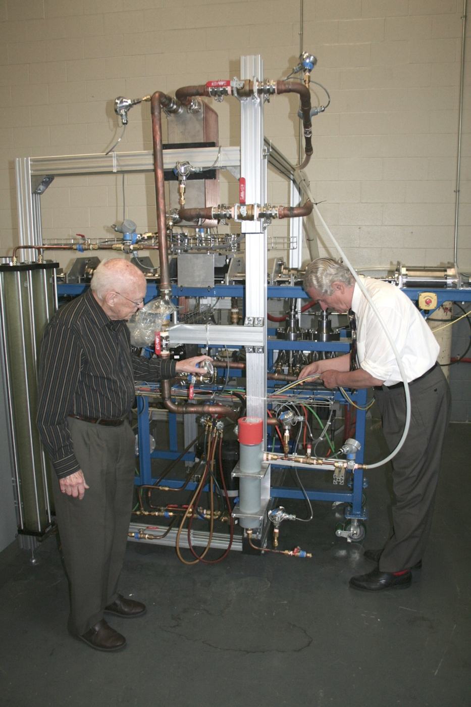Engineers working on the built Rankine-cycle heat-recovery prototype
